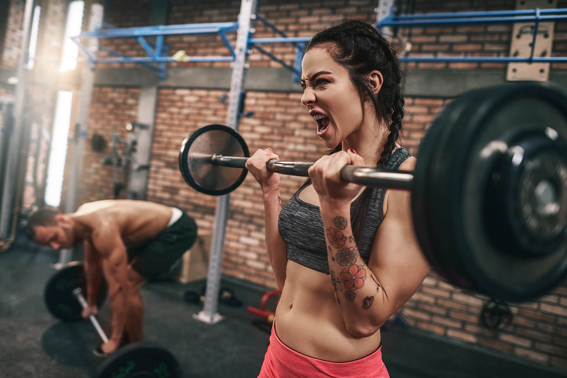 fit-couple-lifting-barbells-in-the-gym-ZACL9S6.jpg